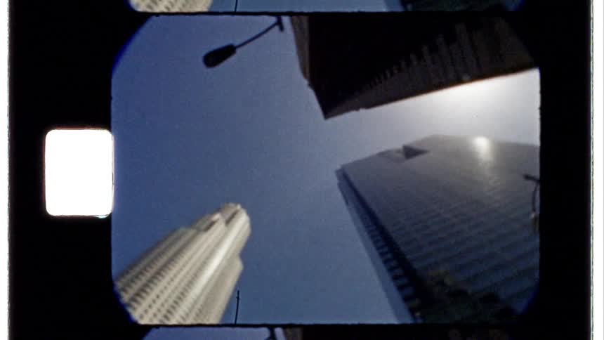 Tall buildings reach into the clear sky