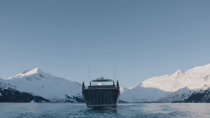 A boat is sailing on a sunny day