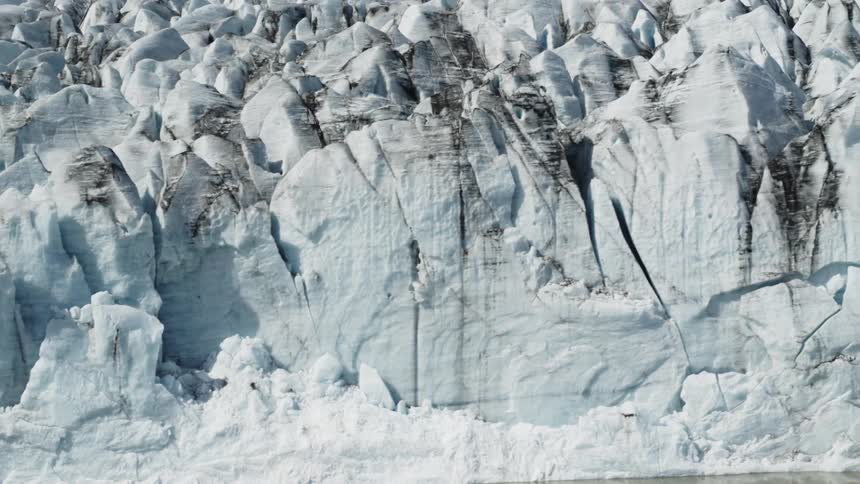 The huge wall of ice has cracks