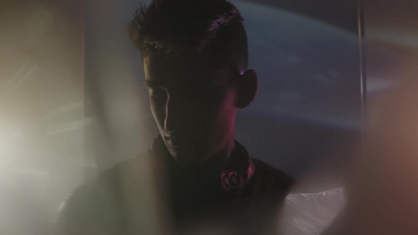 Lights are projected behind a man
