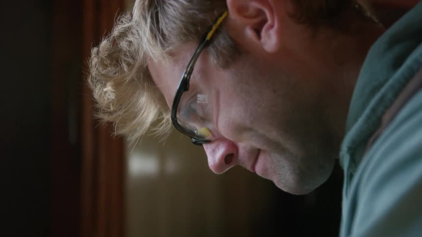 A person is wearing work goggles to protect his eyes