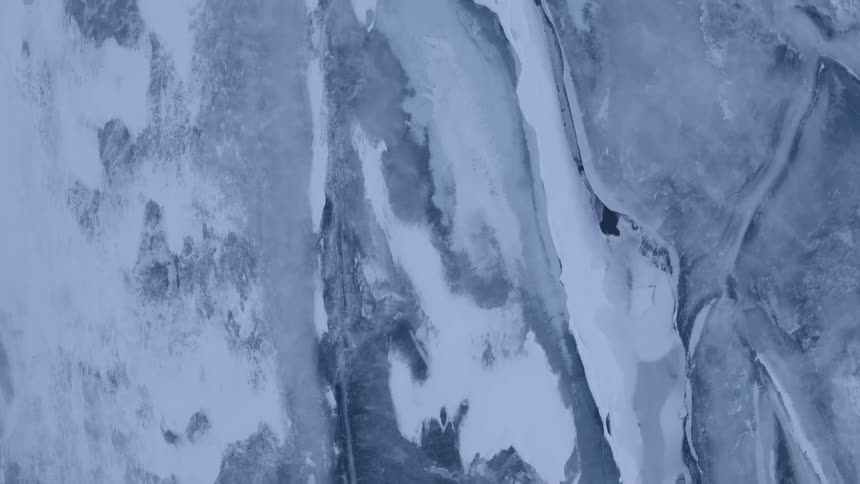 The area below is iced over and covered with snow