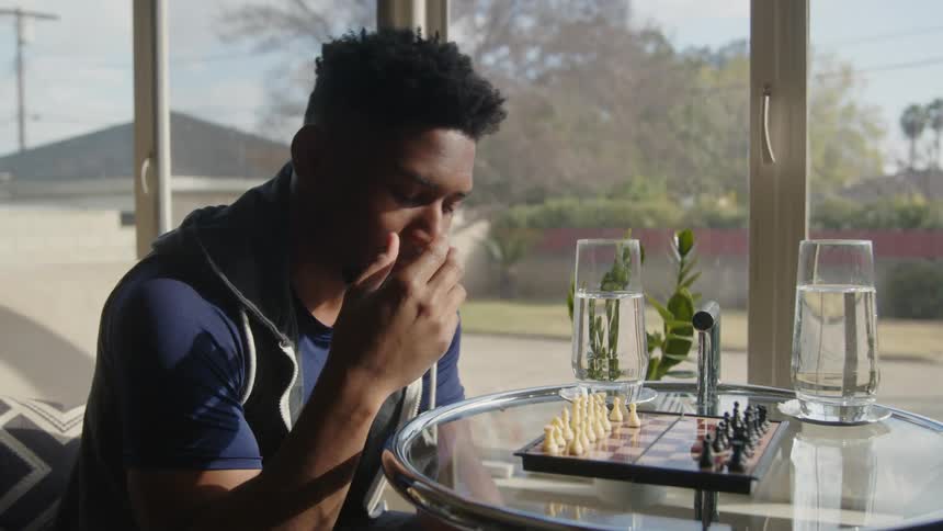 Two friends are playing a game of chess together
