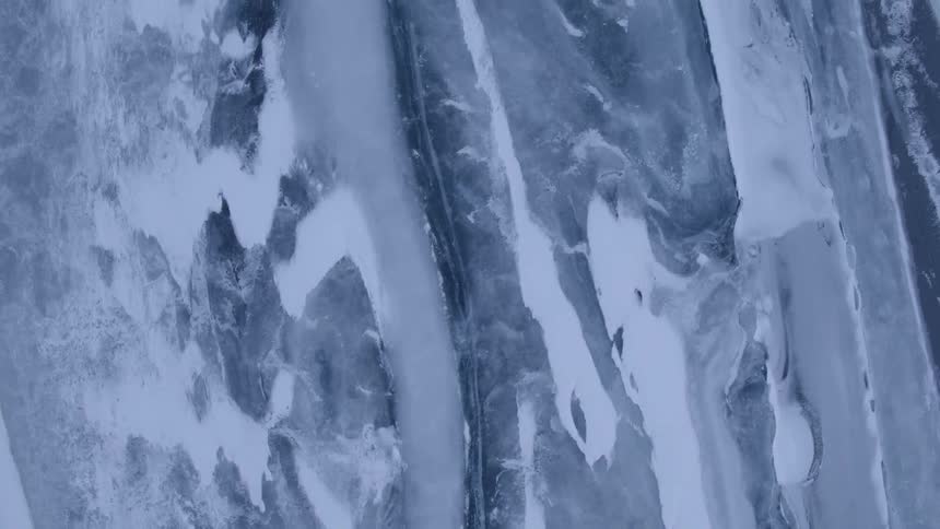 Blue and white streaked ice