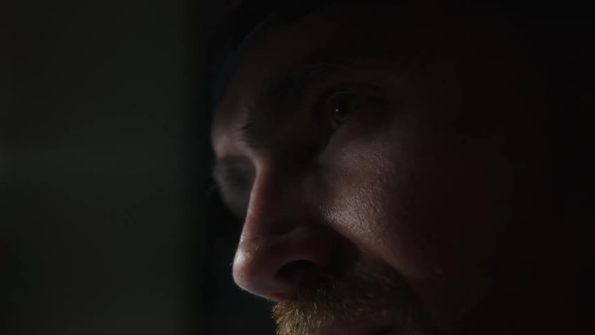 A man looks up at something