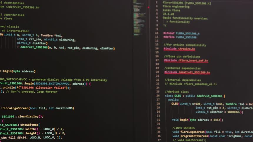 The computer screen is full of code