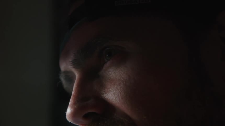 Close up view of a mans face is displayed