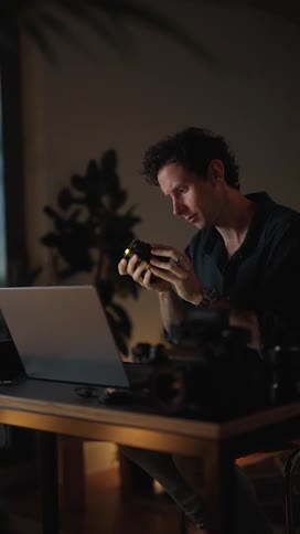 A man is typing on his laptop