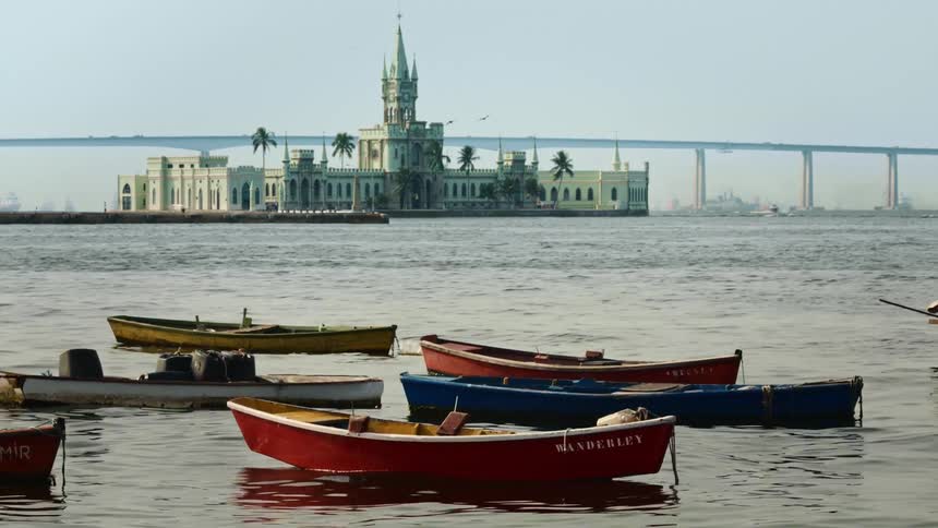 Boats are floating on the body of water at midday