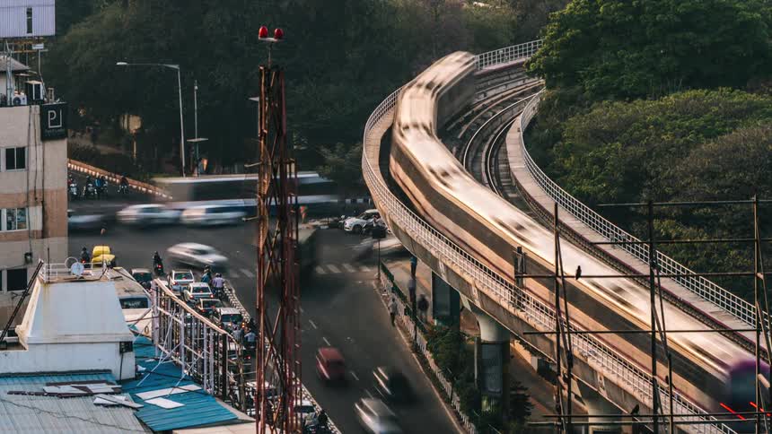 A time lapse of a busy intersection shows countless cars driving along