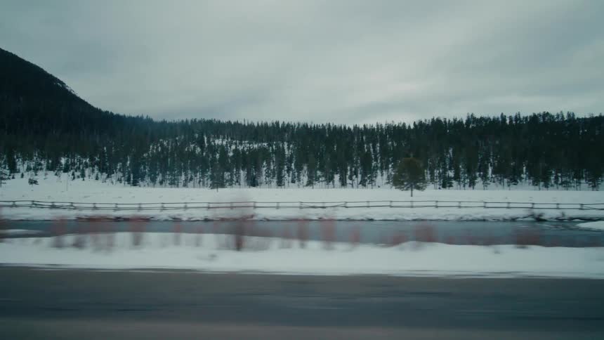 A blanket of snow covers a rural highway