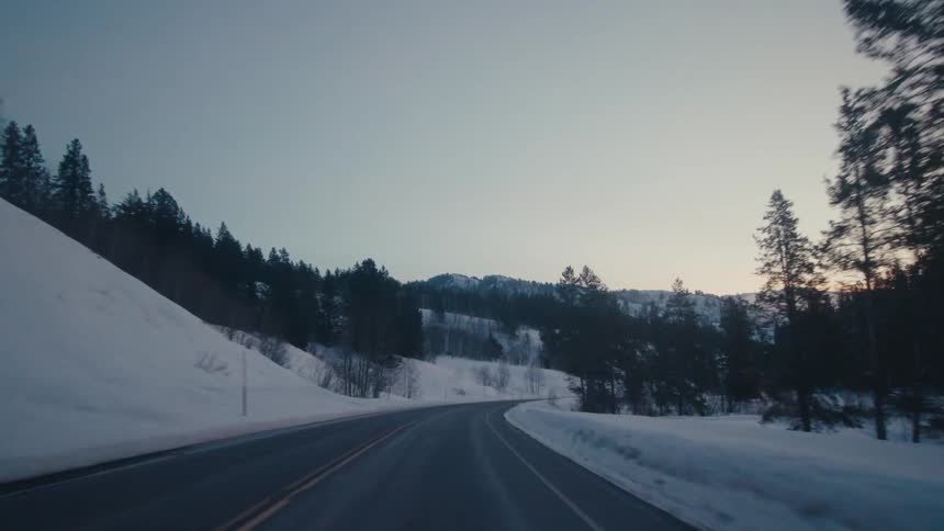 The sun is setting in the wilderness during winter