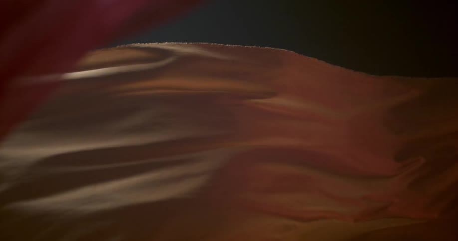 Orange cloth blows in the breeze