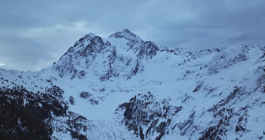 A snowy mountain range in the wilderness in winter