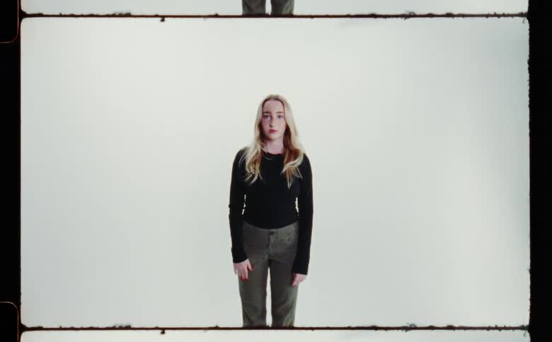 A woman is standing in the film slide