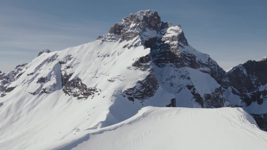 Aerial view of snow covered mountains are displayed