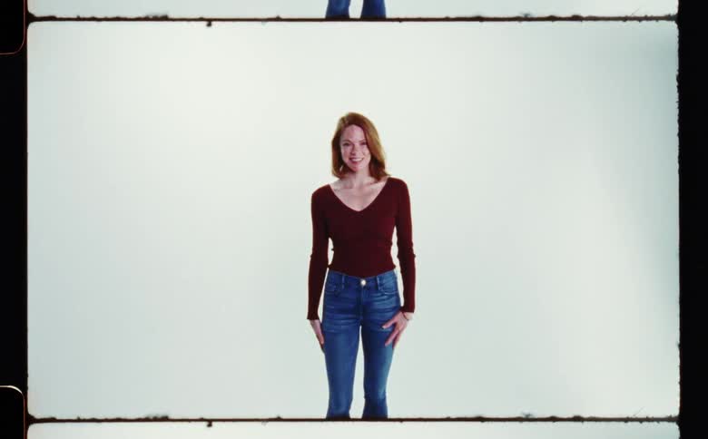 A woman is having fun and posing for the camera