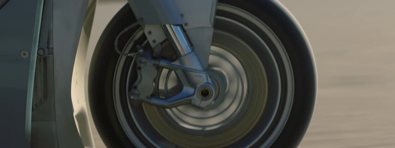 Close up view of a person riding a motorcycle during the day time