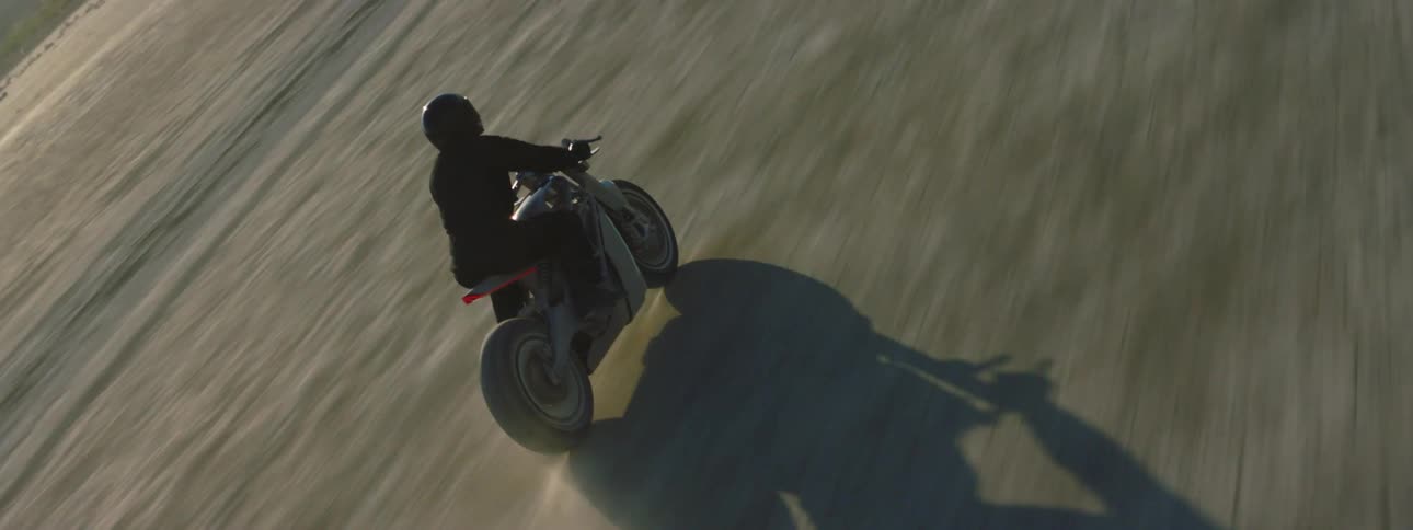 A person is riding their motorcycle off road