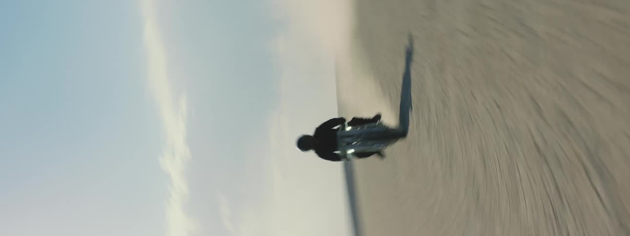 A person races through the desert