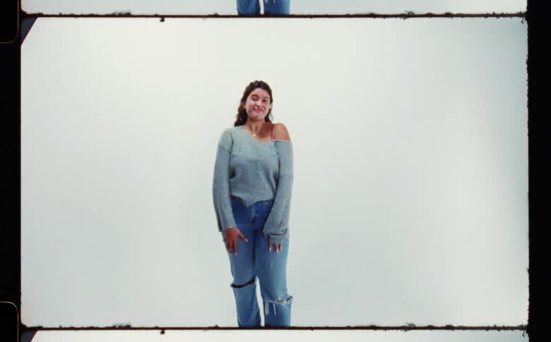 A woman smiles and poses