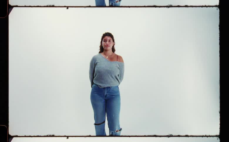 A portrait of a girl while standing in a room