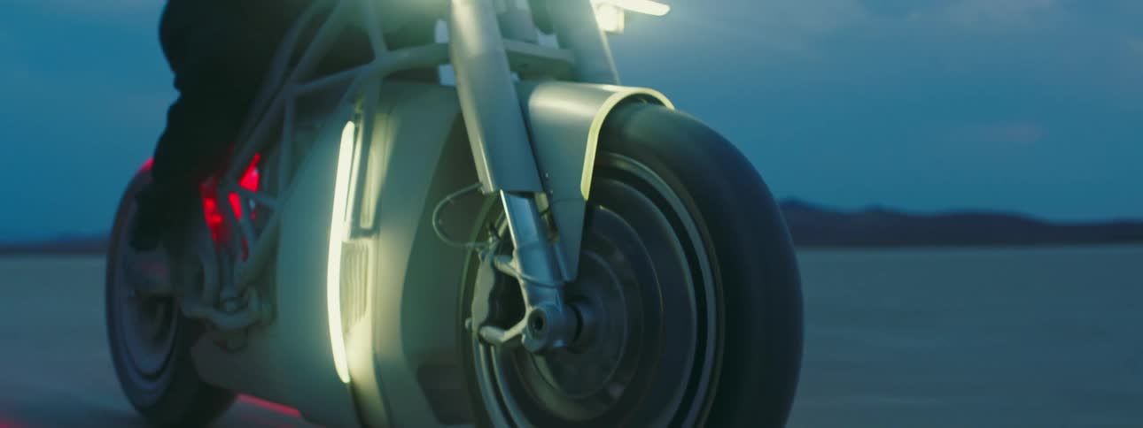 Close up view of a person riding motorcycle during sunset