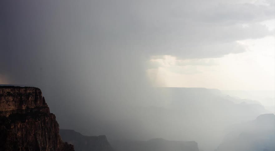A grainy film of a cloud system moving over the Grand Canyon