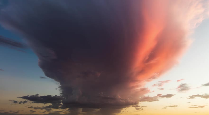 An isolated thnderstorm at sunset over the desert