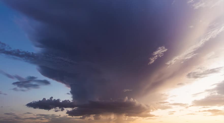 A lightning storm with clouds forming over a landscape