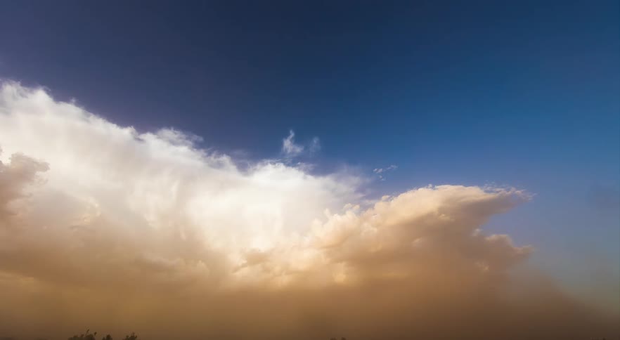 A sunset thunderstorm with dust moving in