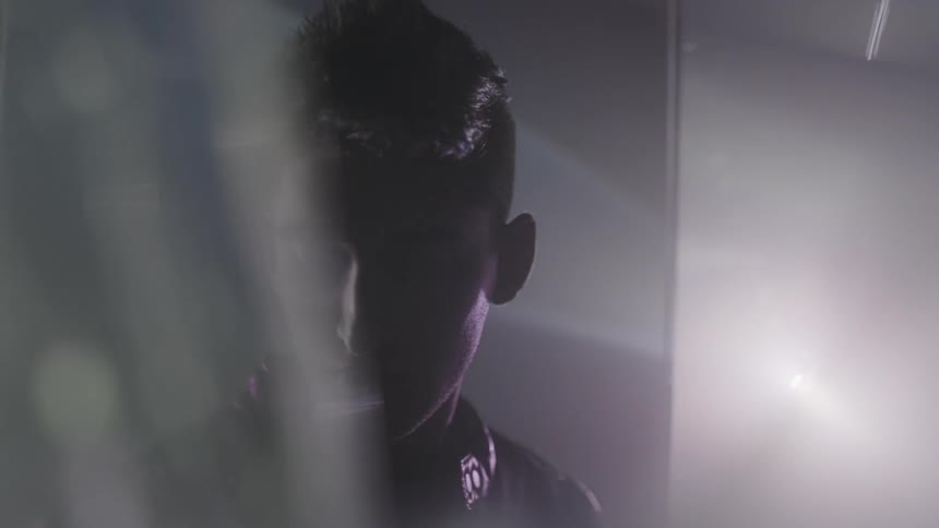 Lights flash on a man in a room
