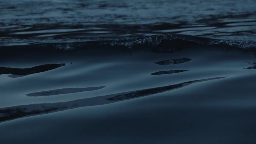 Water ripples at night