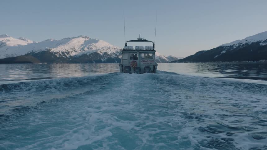 A boat travels over a body of water