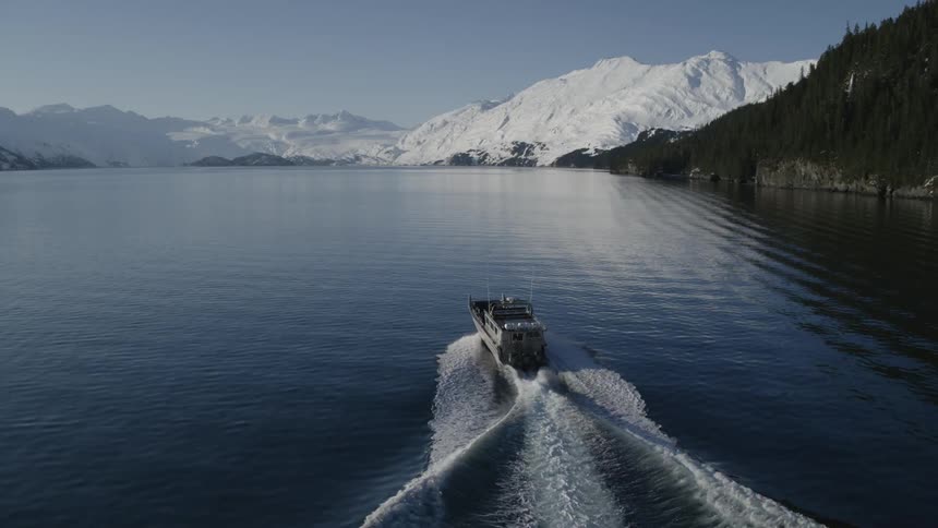 A boat travels across a lake