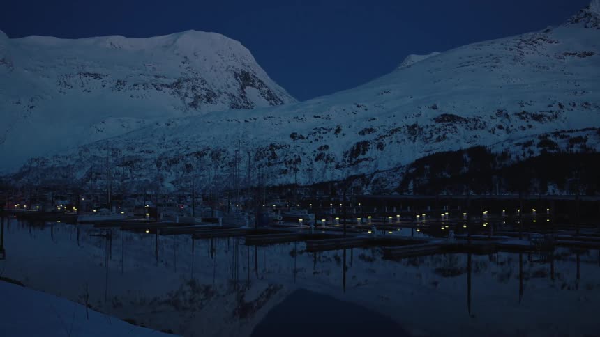 Houses line the bottom of this mountain range