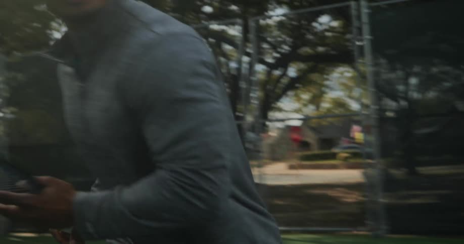 A man is running and playing tennis