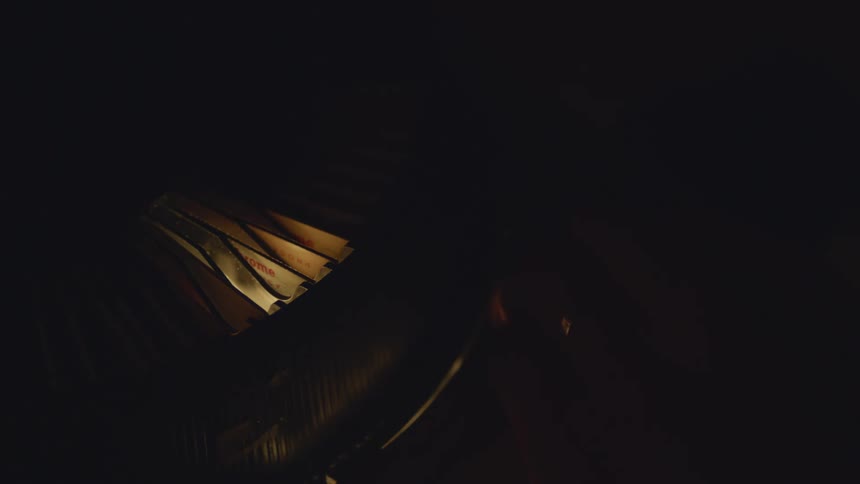 Close up of light coming out of a carousel slide inside a dark room