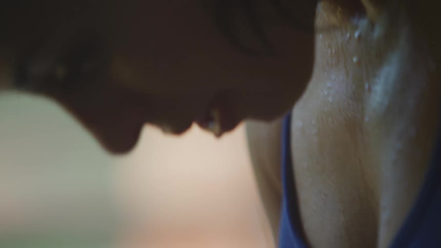 A woman is sweating and breathing heavy