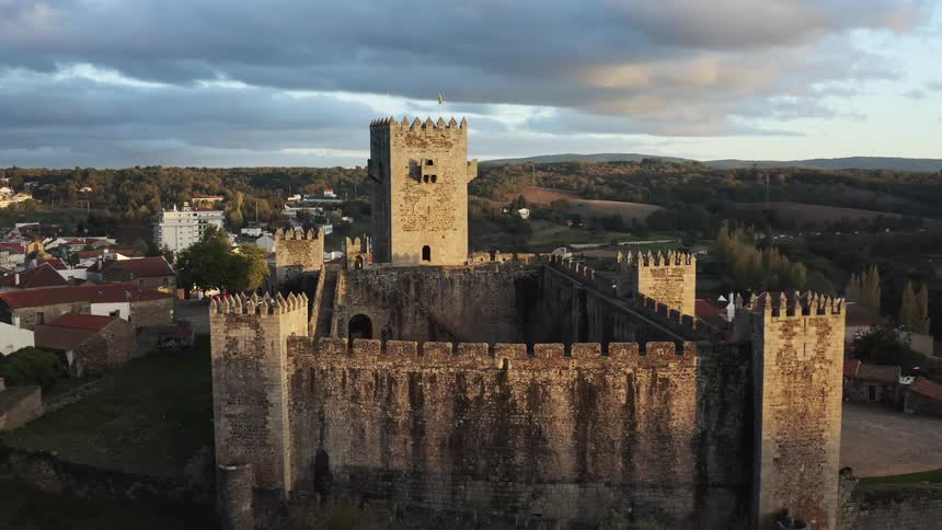 A castle sits above homes in a neighborhood