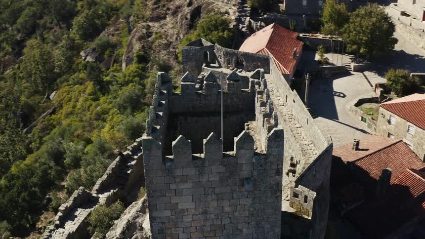 An aerial view of a tall tower from a castle
