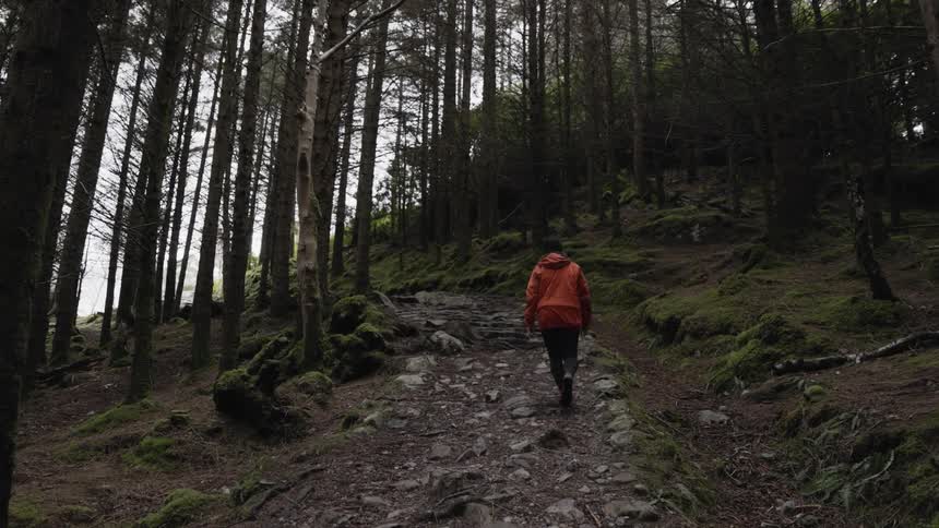 A man hikes uphill