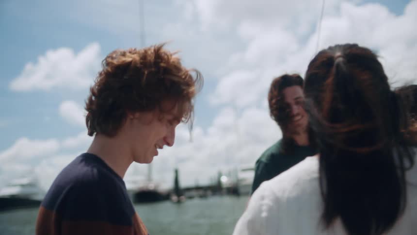 A group of friends are getting into a boat together