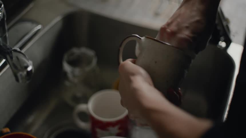 A person is washing dishes