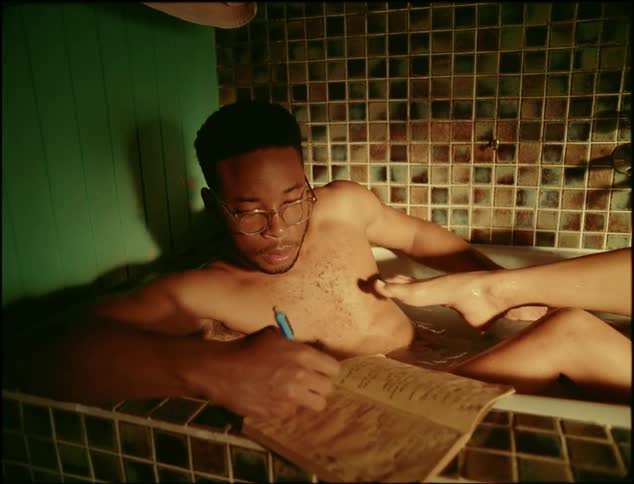 A man and woman are in the bathtub together