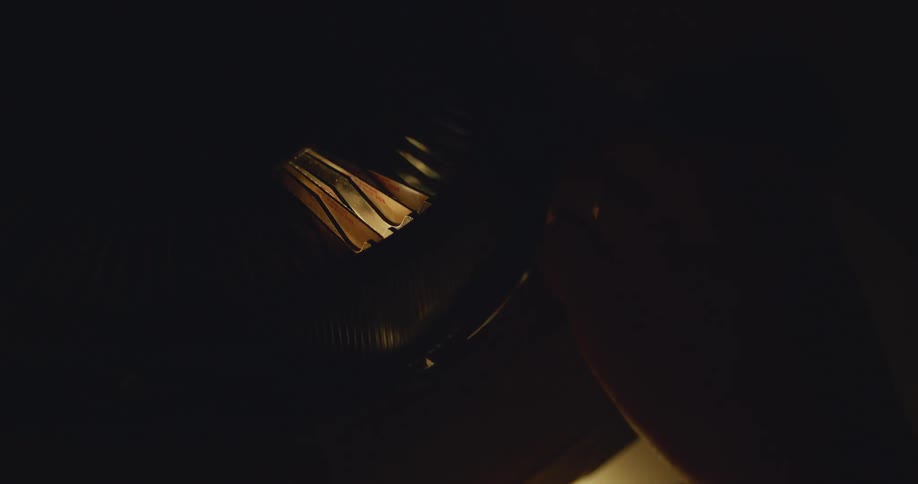 A film projector and slides in a dark room