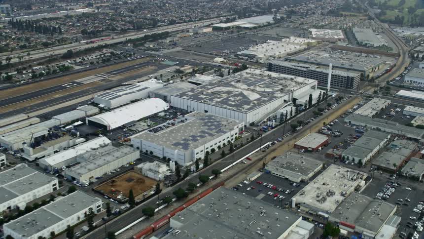 Aerial footage of SpaceX orbiting in the morning over Hawthorne Airport in Southern California