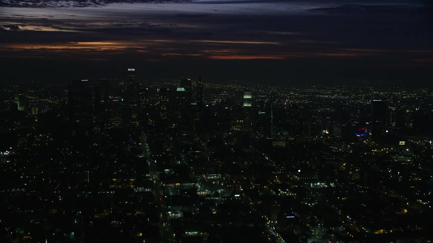 A aerial stock footage of Downtown Los Angeles skyscrapers at sunrise California