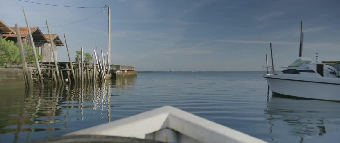 The boat sails from the docks