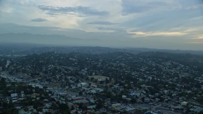 An epic aerial view of sunrise over residential neighborhoods in Echo Park and Silver Lake Los Angeles CA